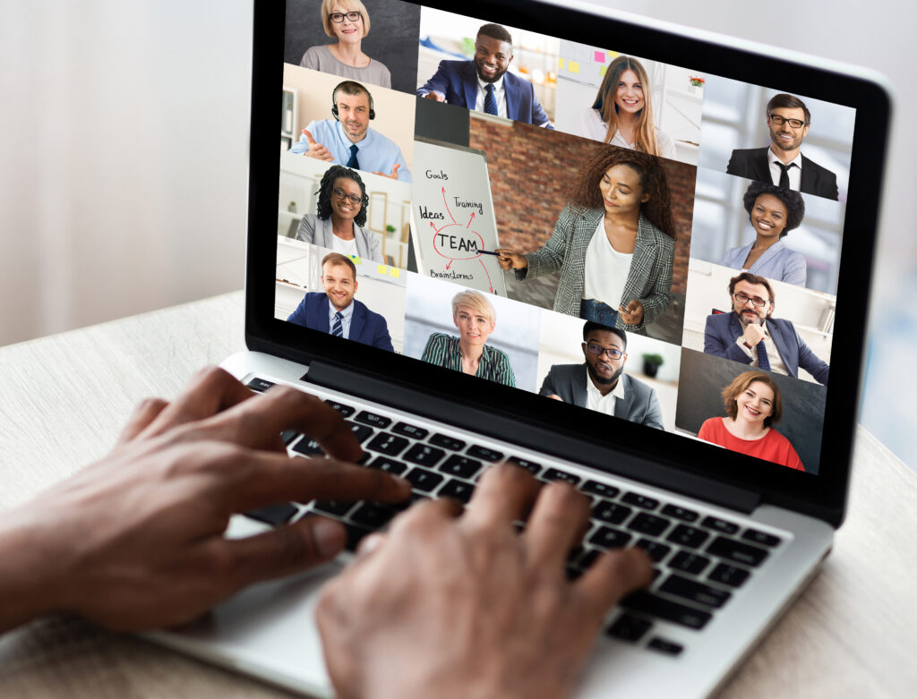 A man logs onto a video conference
