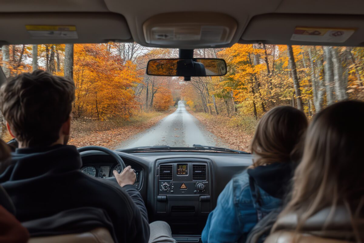 Family in car driving to Thanksgiving dinner